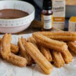 Image of baked churros on parchment paper